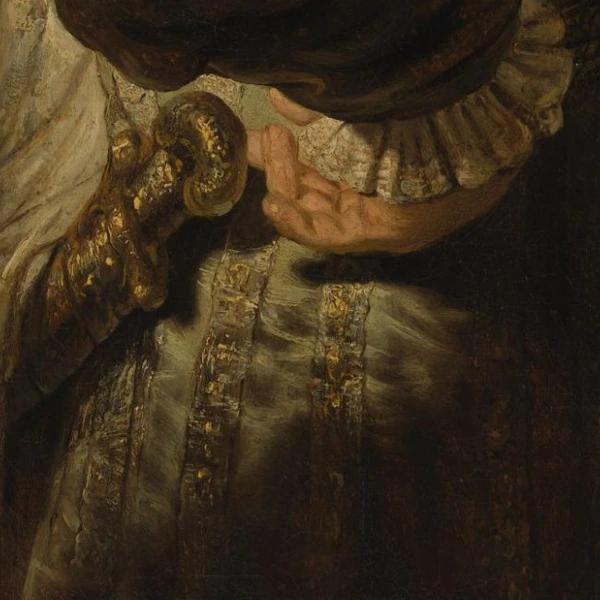 Hand bij het goudkleurige gevest in De vaandeldrager