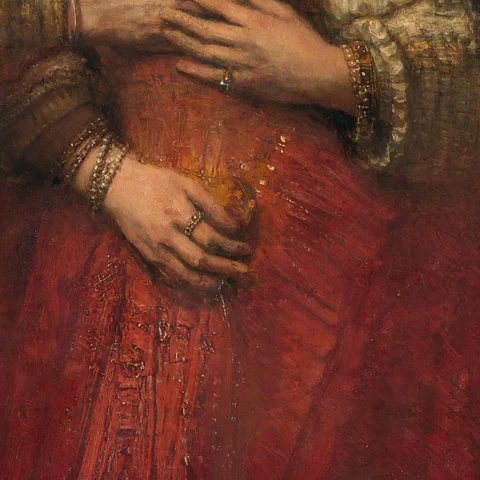 Rode jurk in Het Joodse bruidje van Rembrandt