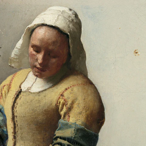 Verlicht gezicht in Het Melkmeisje van Johannes Vermeer