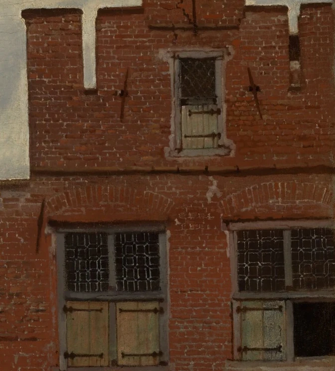 Bakstenen en bovenramen in Het Straatje van Johannes Vermeer